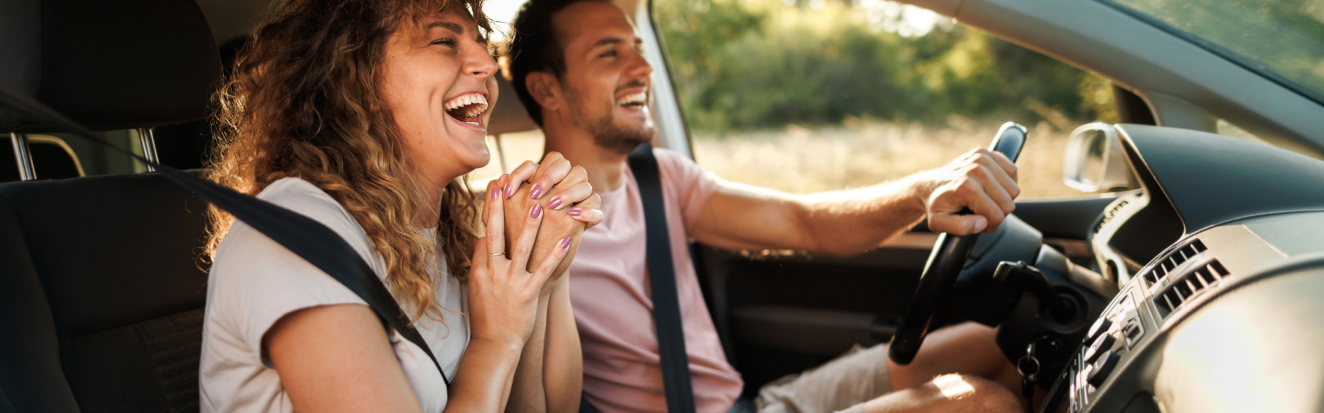 Couple happily driving