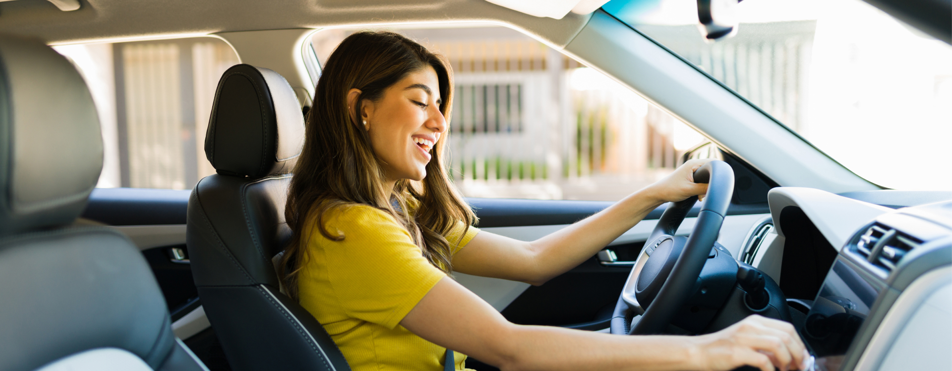 Lady driving off with her used vehicle from Yes! Automotive